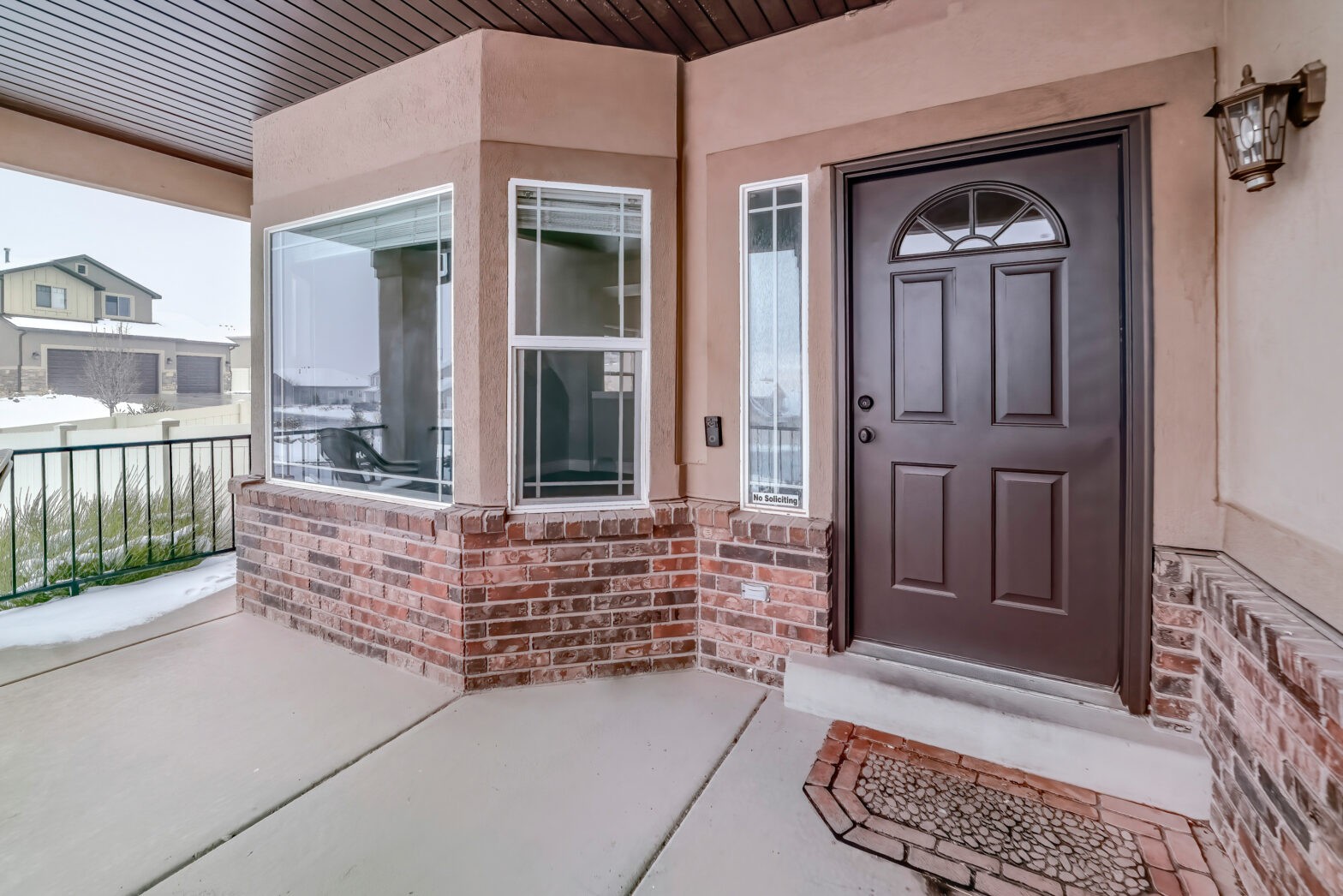 Bay,Window,And,Glass,Paned,Wood,Front,Door,At,The